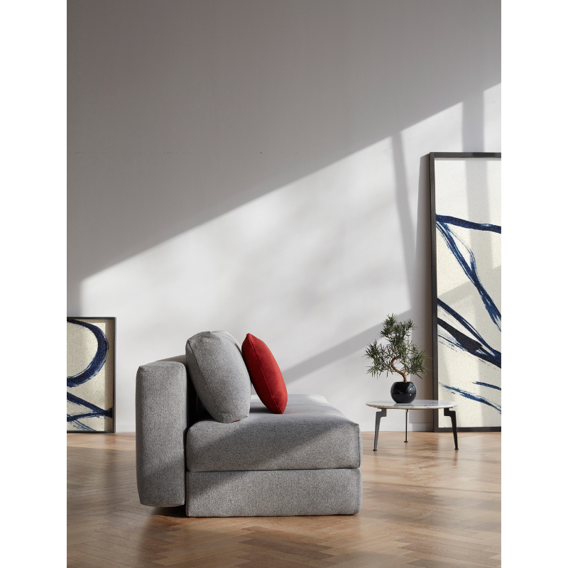 The Osvald Sofa Bed from Innovation Living with twist granite 565 upholstery  in a living area.