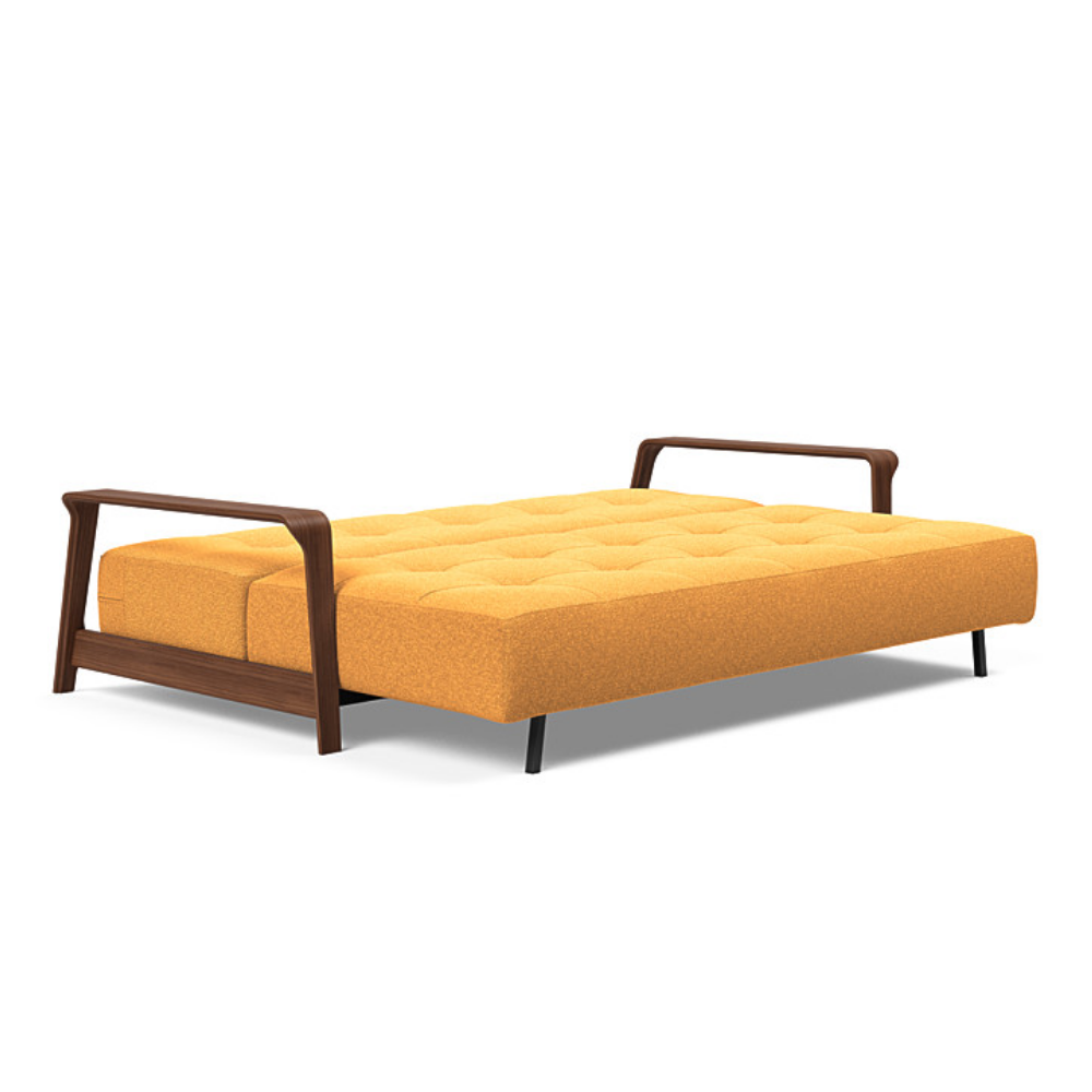 The Ran D.E.L Sofa Bed from Innovation Living with boucle ochre 536 upholstery setup as a bed.