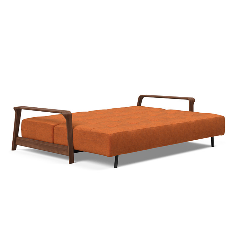 The Ran D.E.L Sofa Bed from Innovation Living with esina rust orange 412 upholstery setup as a bed.