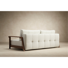The Ran D.E.L Sofa Bed from Innovation Living with mixed dance natural 527 upholstery in a lounge.