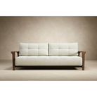 The Ran D.E.L Sofa Bed from Innovation Living with mixed dance natural 527 upholstery in a studio.