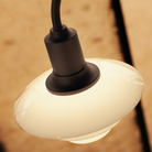 Shade detail of the PH 1/1 Chandelier, 3-Light by Louis Poulsen turned on.