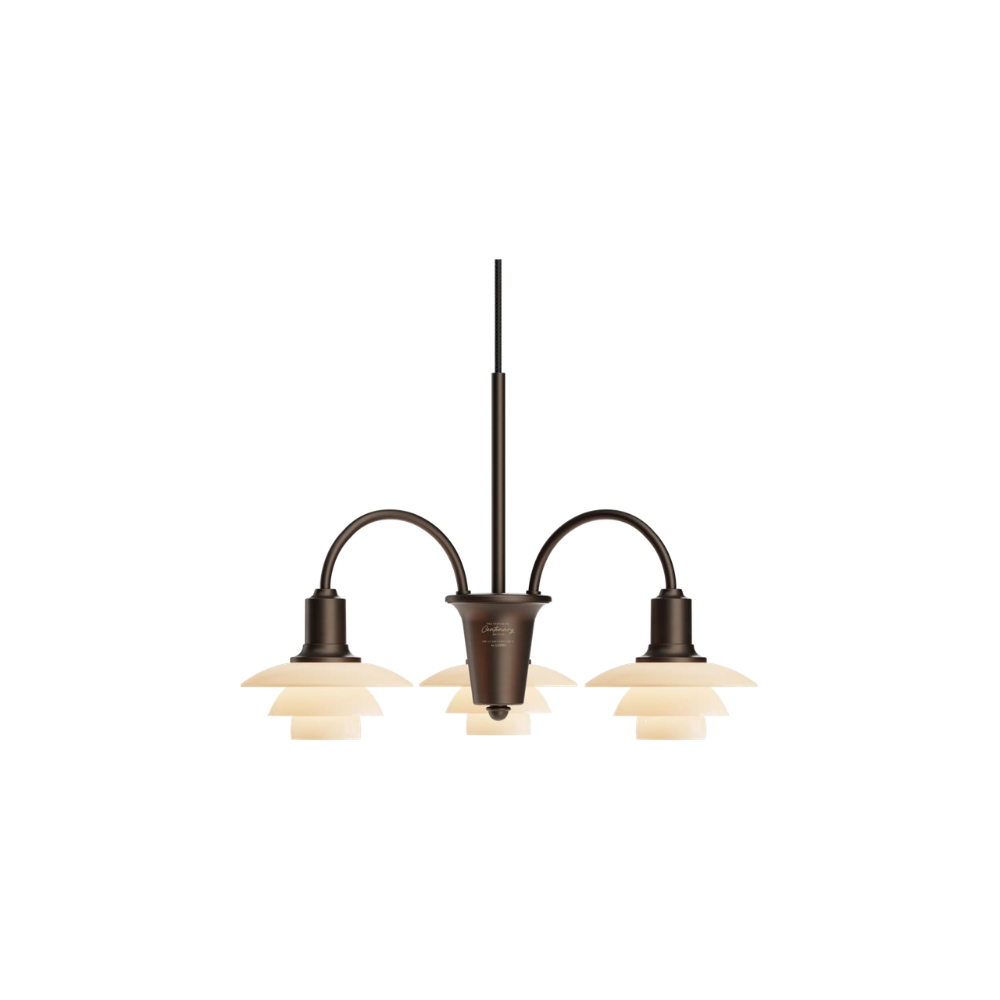 The PH 1/1 Chandelier, 3-Light by Louis Poulsen turned on.