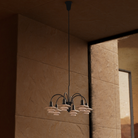 Campaign photo of the PH 1/1 Chandelier, 6-Light by Louis Poulsen turned off.