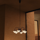 Campaign photo of the PH 1/1 Chandelier, 6-Light by Louis Poulsen turned on.
