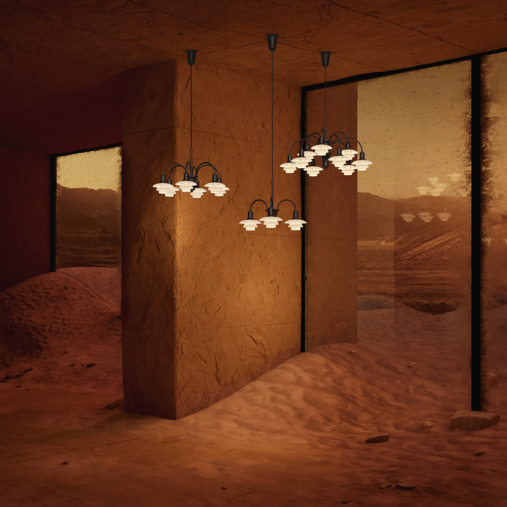Campaign photo of the PH 1/1 Chandelier, 3-Light, 6-Light and 9-Light by Louis Poulsen turned on. all-groups