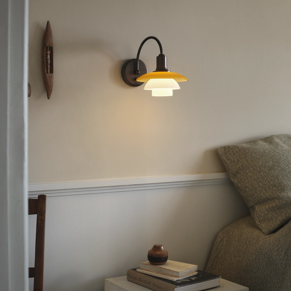 PH 2/2 Wall Lamp Centenary Edition with switch in bedroom turned on.