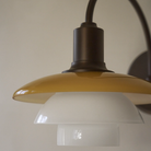Close up of the glass shades of the PH 2/2 Wall Lamp Centenary Edition while turned off. all-groups