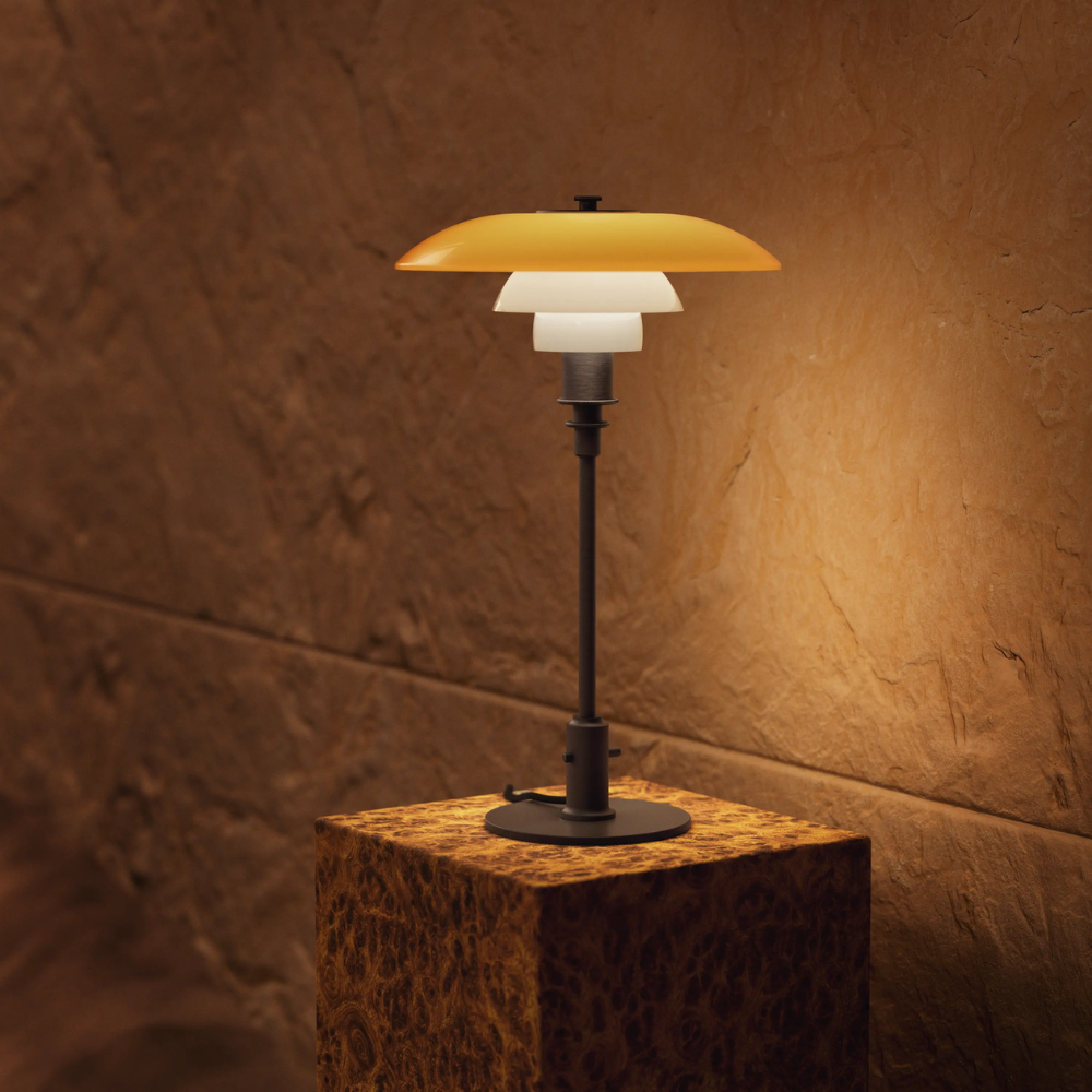 The PH 3/2 Table Lamp Centenary Edition by Louis Poulsen turned on.