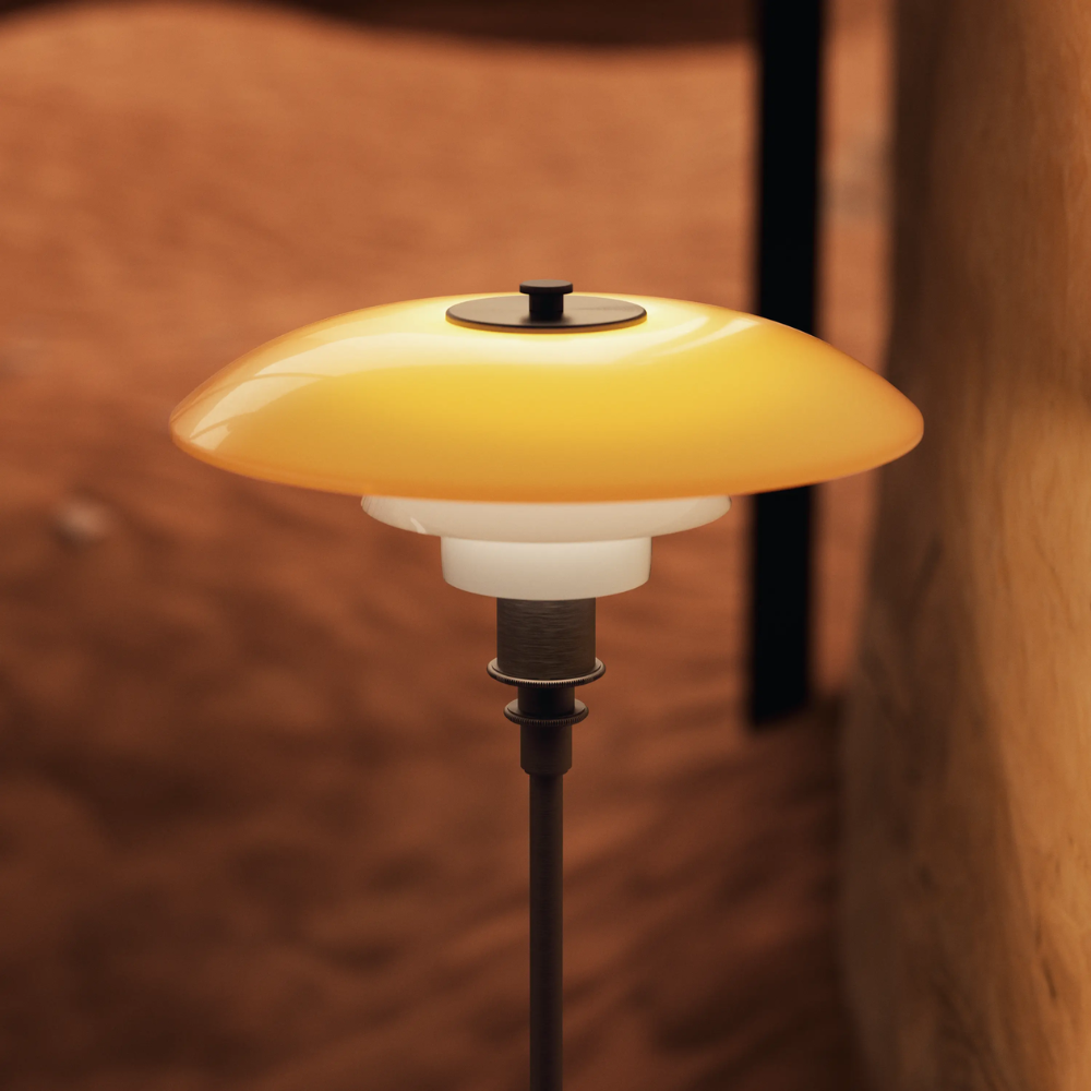 Close up of the amber and opal shades of mouth-blown glass of the PH 3/2 Table Lamp Centenary Edition by Louis Poulsen.