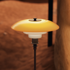 Close up of the amber and opal shades of mouth-blown glass of the PH 3/2 Table Lamp Centenary Edition by Louis Poulsen.