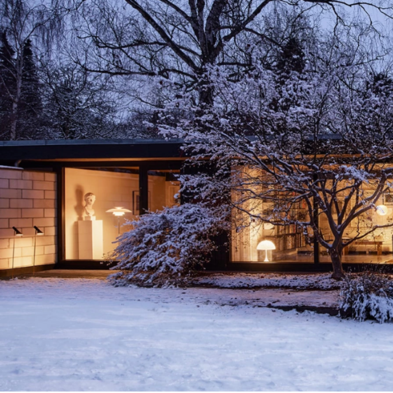 The AJ Garden Bollard from Louis Poulsen in a lifestyle shot.