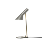 The AJ Mini Tble Lamp in Brass/Warm Grey.