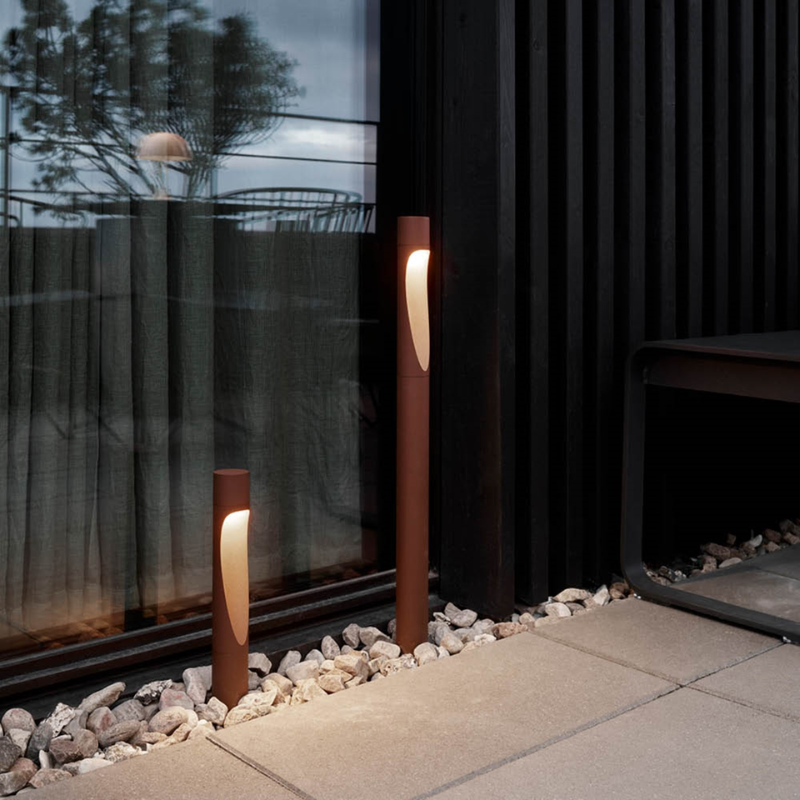 The Flindt Garden Bollard, crafted by renowned Danish designer Christian Flindt with Louis Poulsen, offers premier outdoor illumination for spaces like parks, courtyards, and gardens without sacrificing light quality or design. 