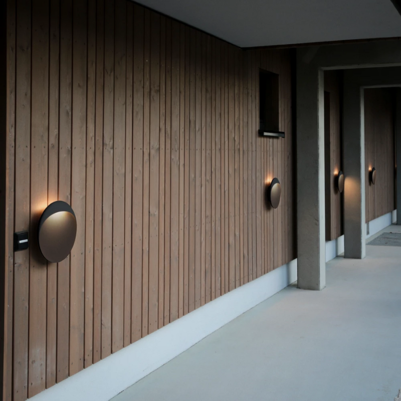 The Flindt Wall from Louis Poulsen in a lounge lifestyle photograph.