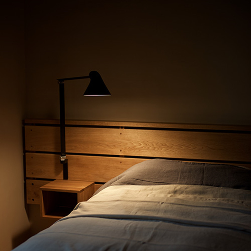 The NJP Wall from Louis Poulsen in a bedroom.