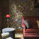 The Panthella 160 Portable Lamp from Louis Poulsen in Original Opal Red in a living room.