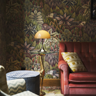 The Panthella 250 Portable Table Lamp from Louis Poulsen in Original Opal Brown on a side table.