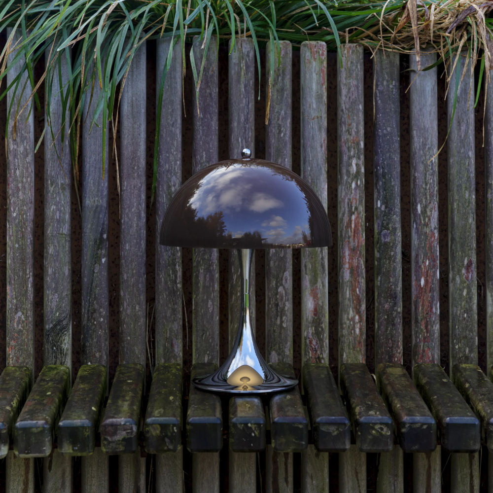 The Panthella 250 Portable Table Lamp from Louis Poulsen in Original Opal Brown turned off outside.