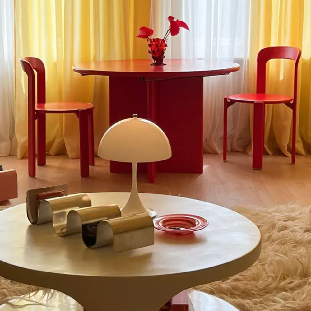 The Panthella 250 Portable Table Lamp from Louis Poulsen in Opal white in a living room.