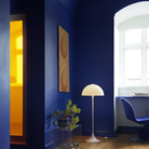 The Panthella 400 Floor Lamp by Louis Poulsen in a living room.