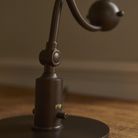 Close up of the switch on the PH 1/1 Piano Table Lamp by Louis Poulsen.