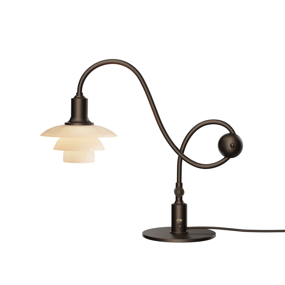 The PH 1/1 Piano Table Lamp by Louis Poulsen turned on.