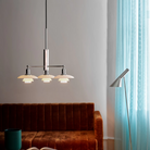 The PH 2/1 Stem Fitting from Louis Poulsen in a living room.