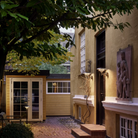 The PH 3-2½ Wall from Louis Poulsen in a courtyard.