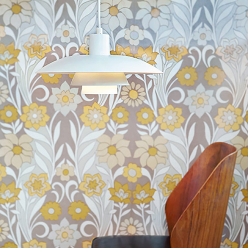 The PH 4/3 Pendant from Louis Poulsen in a living room lifestyle photograph.