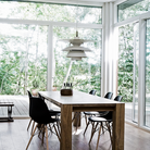 The PH 5-4½ or PH 6½-6 from Louis Poulsen in a dining room.