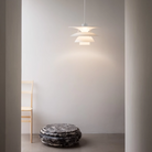 The PH 5-4½ or PH 6½-6 from Louis Poulsen in a living room.