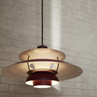 The PH 5 from Louis Poulsen in monochrome burgundy from below.