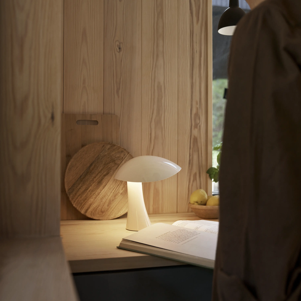 Rumee 220 Portable Lamp in Cloud White on a kitchen counter.