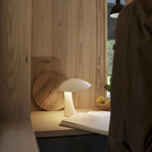Rumee 220 Portable Lamp in Cloud White on a kitchen counter.