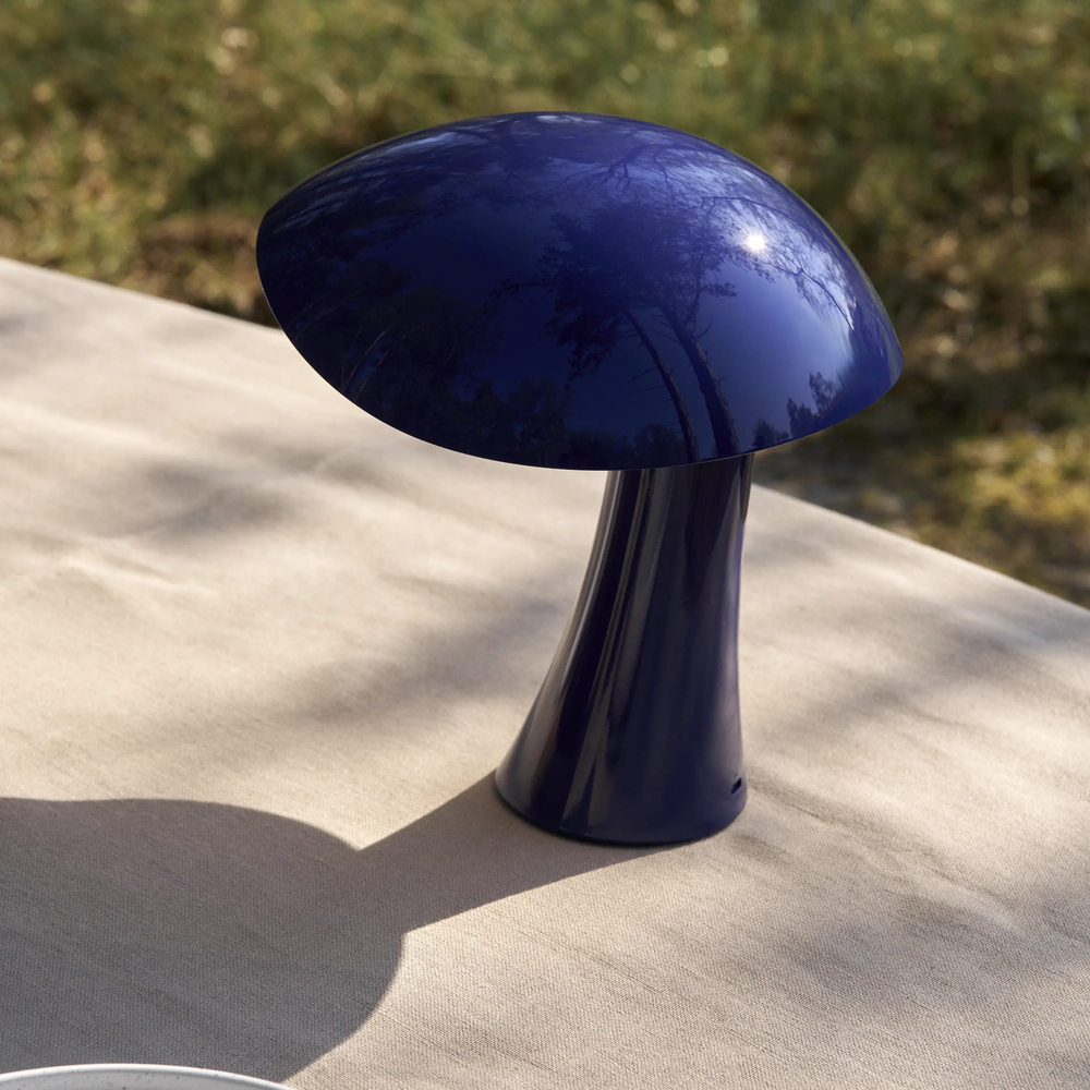 Rumee 220 Portable Lamp in Night Blue outside.