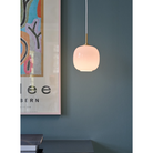 The VL45 Radiohus Pale Rose Pendant from Louis Poulsen in a primary bedroom.