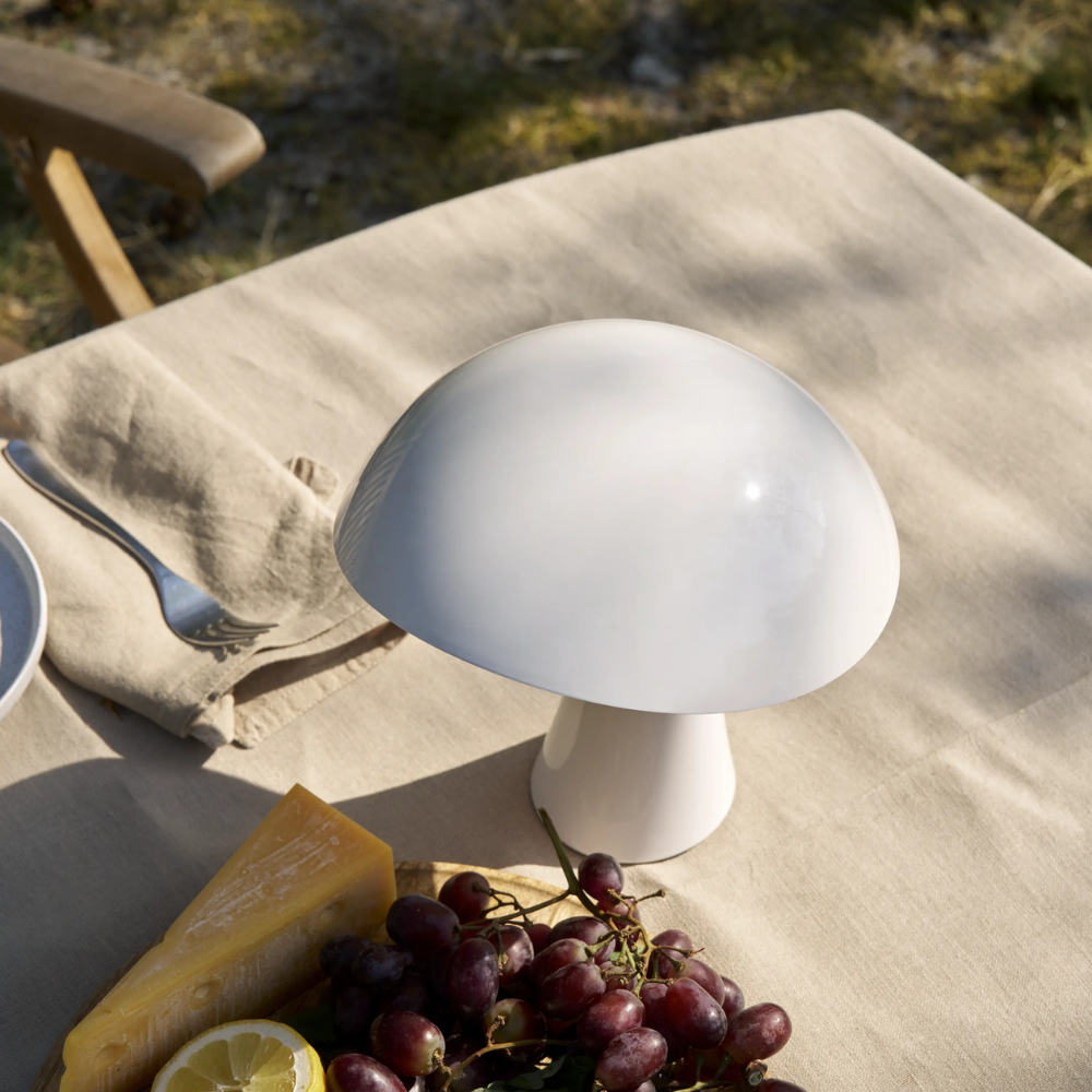 Rumee 220 Portable Lamp in Cloud White on a table.