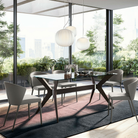 The Lita Pendant by Luceplan, 11.8-inch  and 16.5-inch pendants in matte white over dining table.