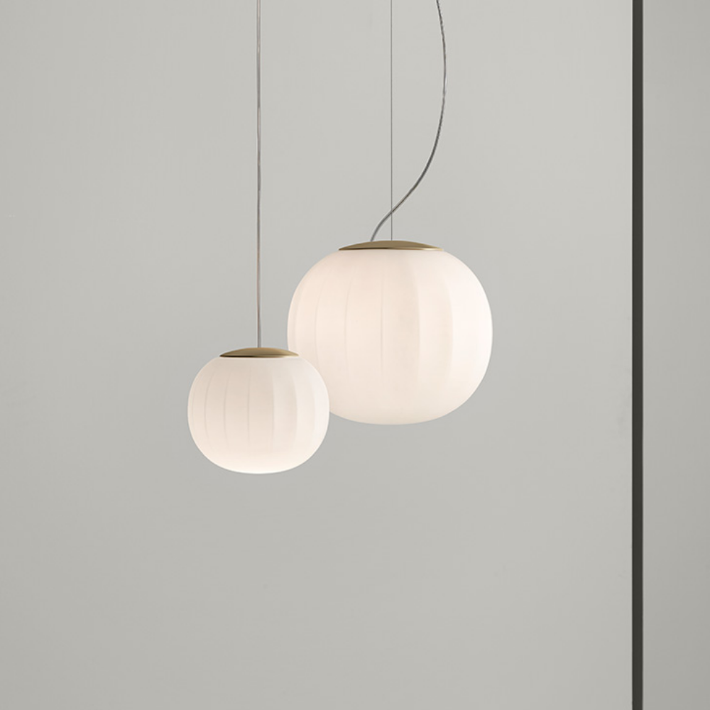 The Lita Pendant by Luceplan, 7-inch and 11.8-inch pendants in brass.