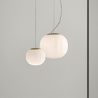 The Lita Pendant by Luceplan, 7-inch and 11.8-inch pendants in brass.