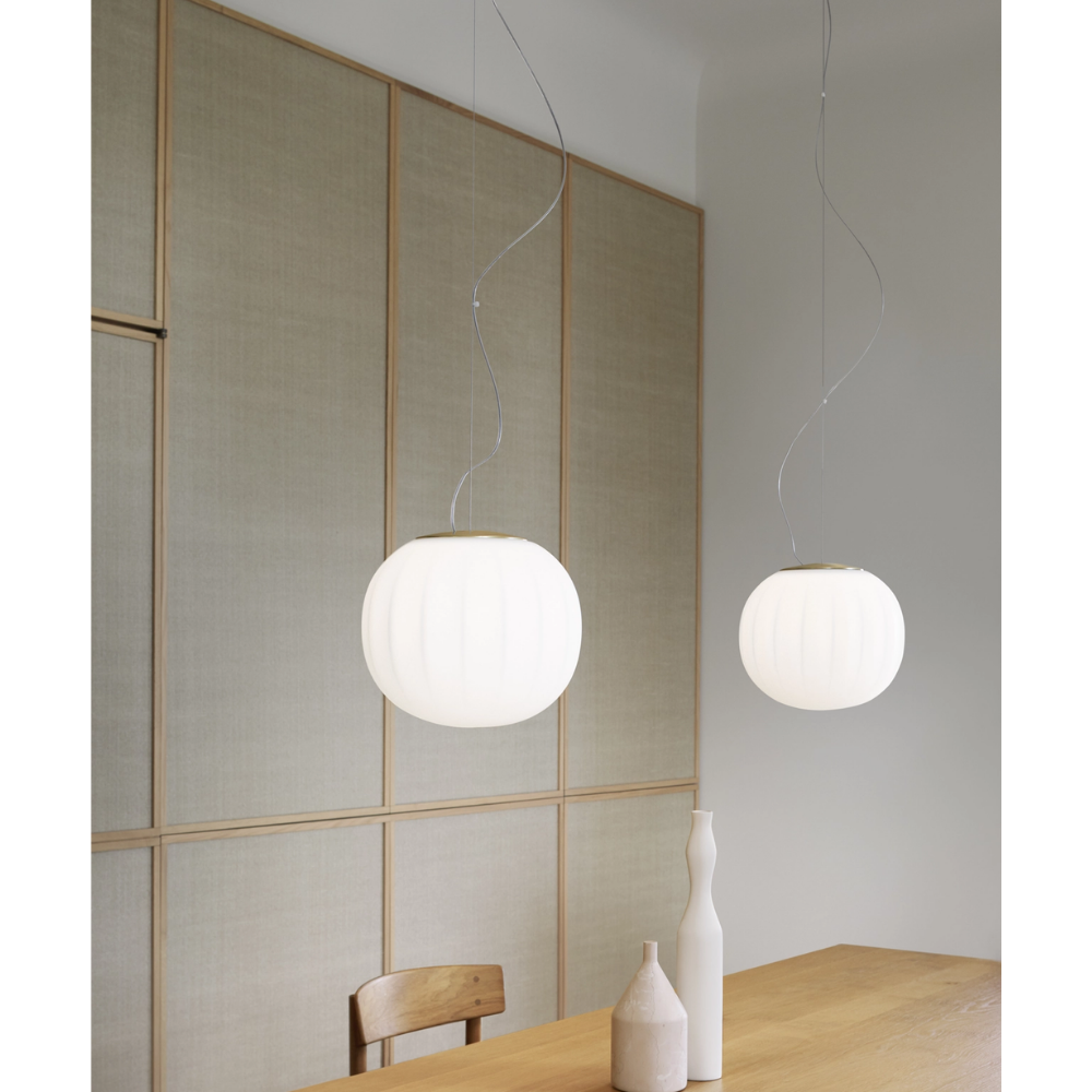 The Lita Pendant by Luceplan, 11.8-inch over a dining table.
