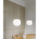 The Lita Pendant by Luceplan, 11.8-inch over a dining table.