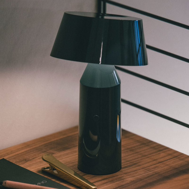 The Bicoca Portable Table Lamp from Marset in anthracite in a living space.