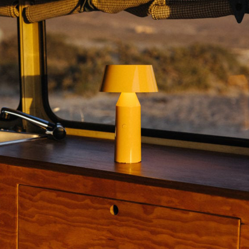 The Bicoca Portable Table Lamp from Marset in yellow in a kitchen.