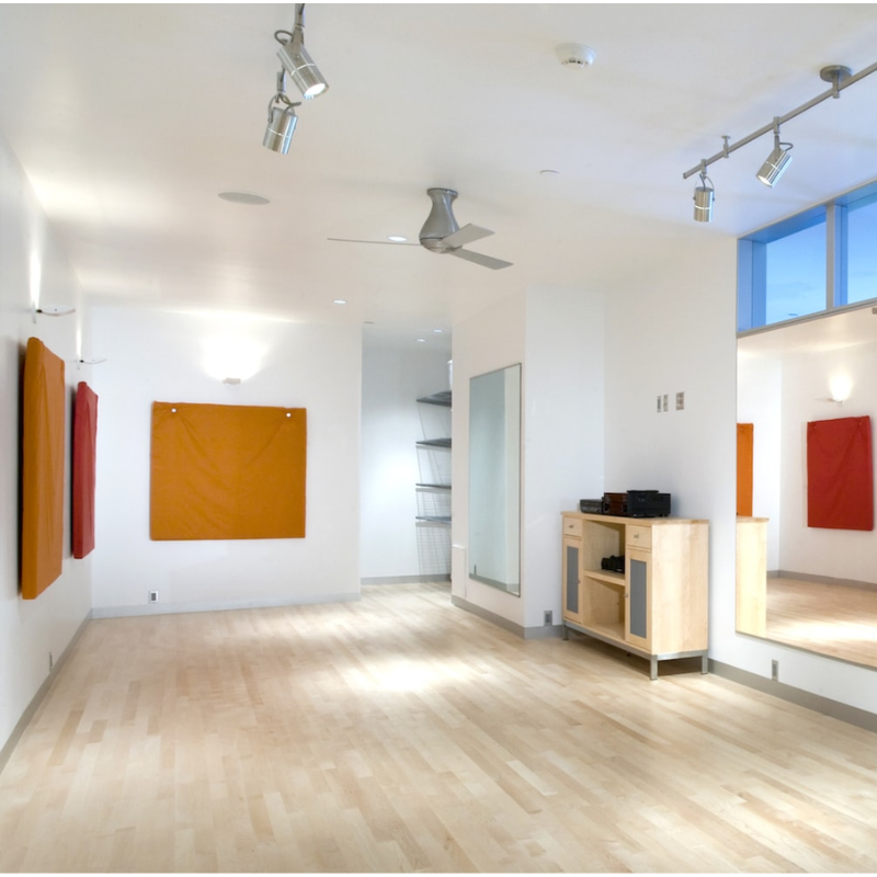 The brushed aluminum and aluminum Altus Flush from Modern Fan Co. in an art studio, or open living room.