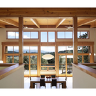 The Altus suspended ceiling fan from The Modern Fan Co. within a lounge area.