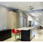 The Altus suspended ceiling fan from The Modern Fan Co. over the sink in a kitchen.