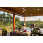 The Altus ceiling fan from The Modern Fan Co. in an outdoor lounge and BBQ area.