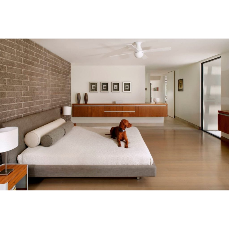 The Ball Flush ceiling fan from The Modern Fan Co. with 42" blades and the LED option. This fan has the gloss white fan finish, and white blade color in a minimalistic bedroom.